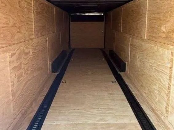 Inside the 24 ft enclosed car hauler rental: E-Track in the floor for securing vehicles