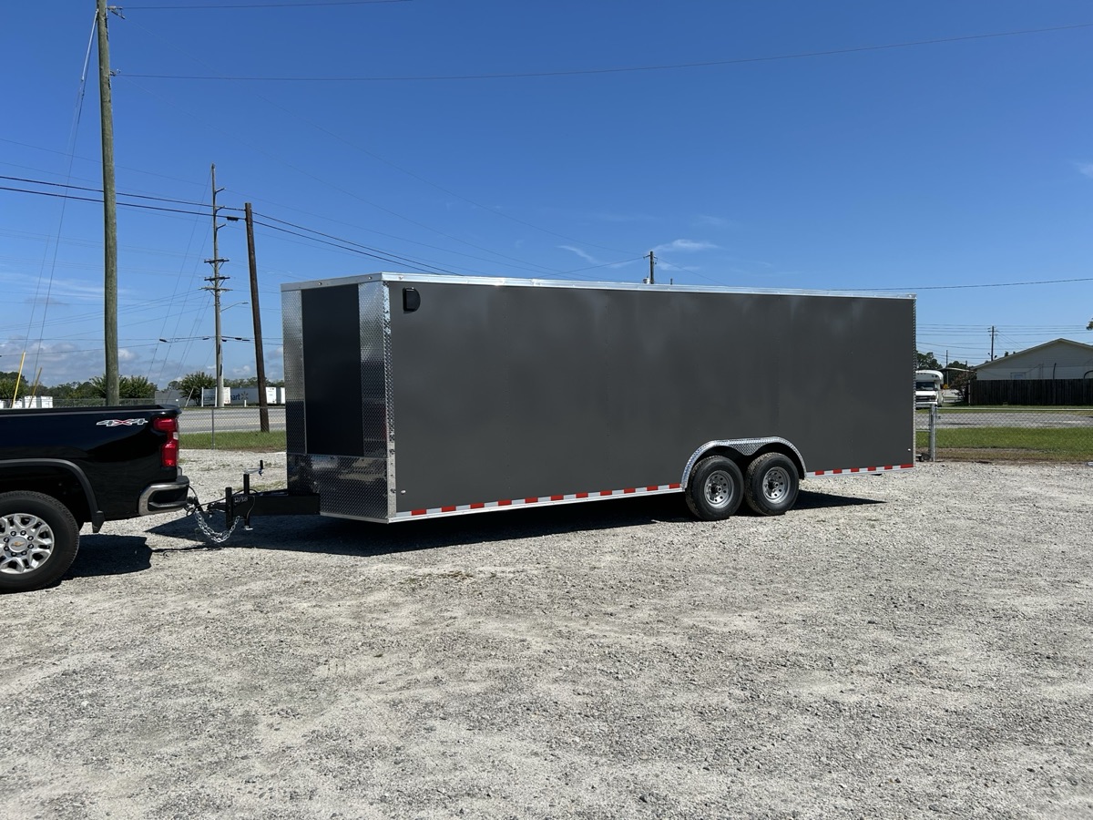 24 ft enclosed cargo trailer for rent in Branford, CT, hitched to a pickup