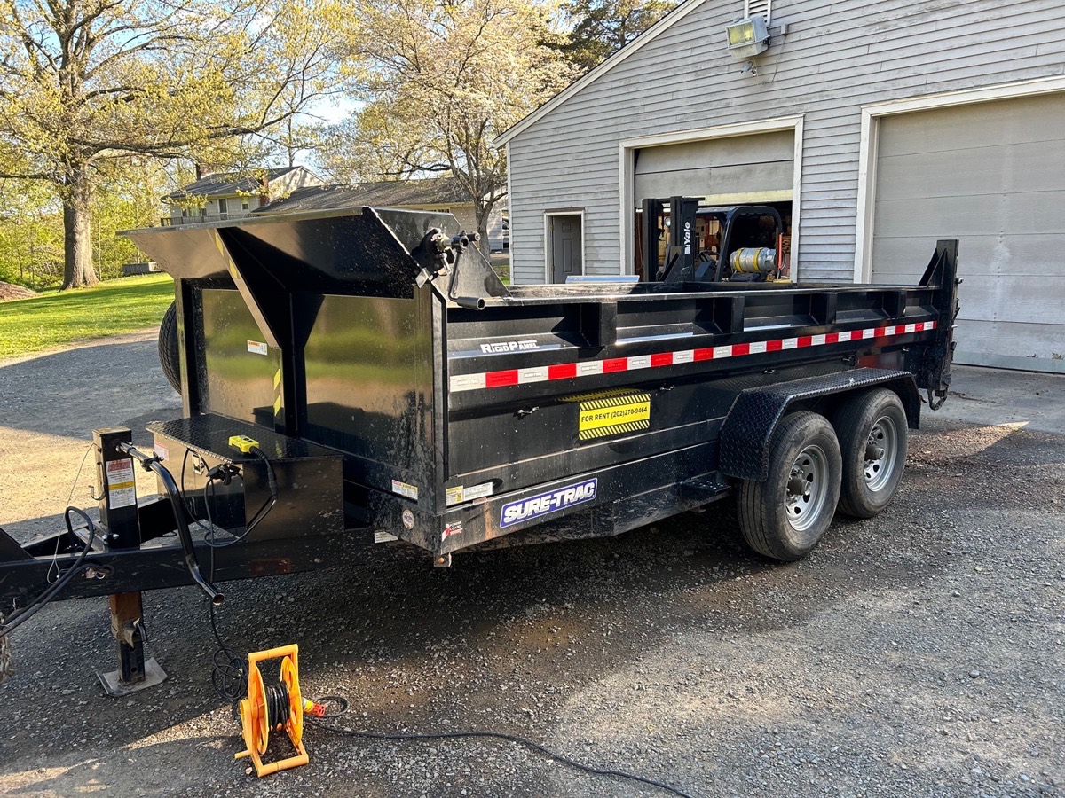 Dump trailer rental, front view with the tongue jack down