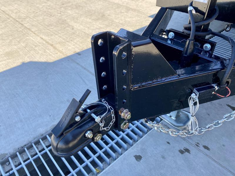 Scissor-hoist dump trailer rental shown from the side with the bed raised