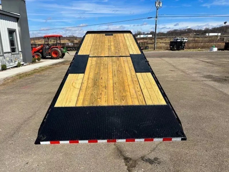 Tilt deck equipment trailer rental, deck lowered to the ground