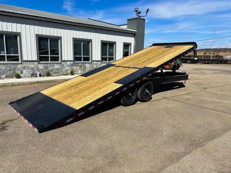 Power-tilt deckover equipment trailer for rent in Branford, CT, deck tilted for loading