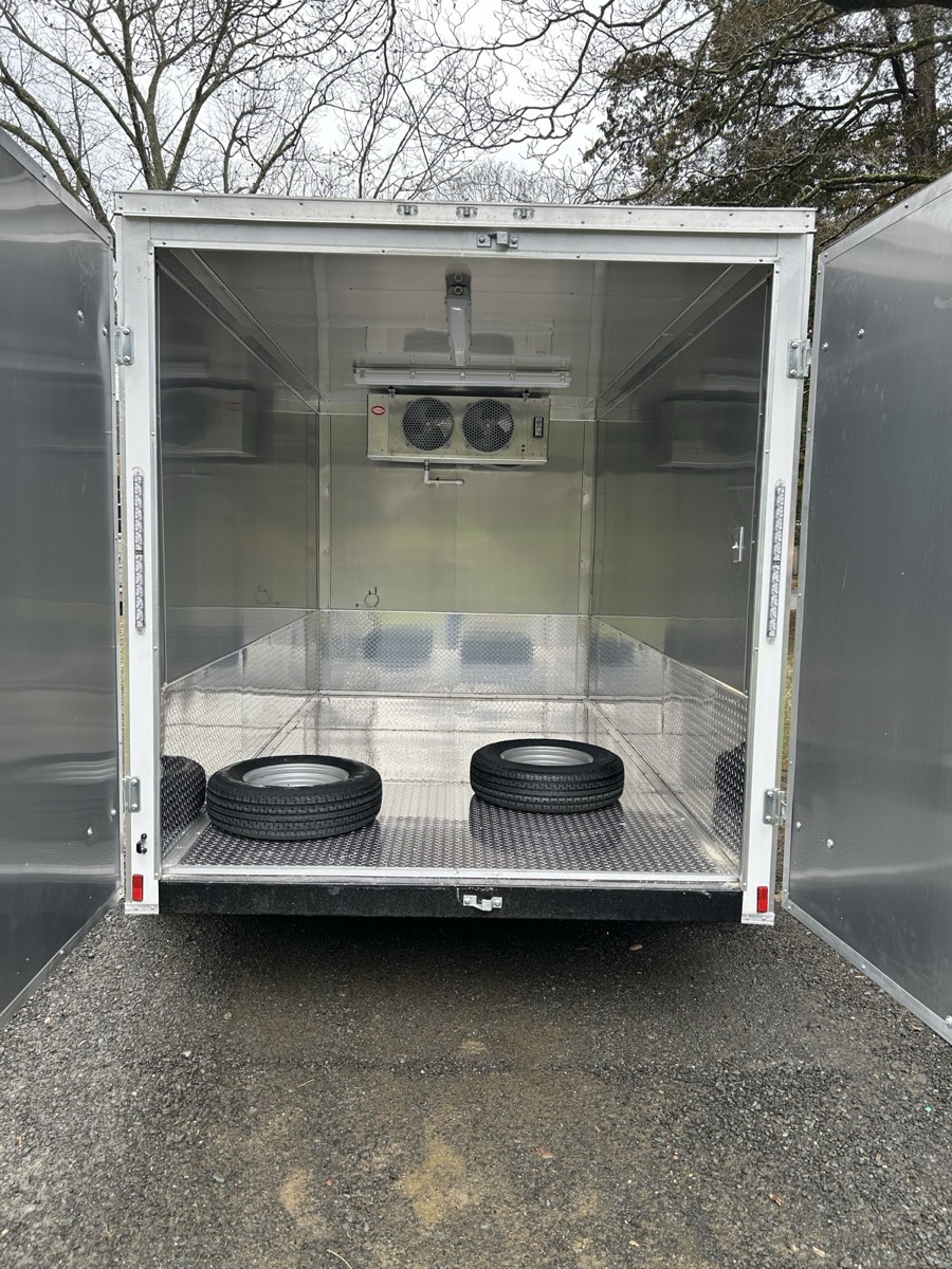 Inside the refrigerated trailer rental: cooling unit and aluminum tread-plate floor